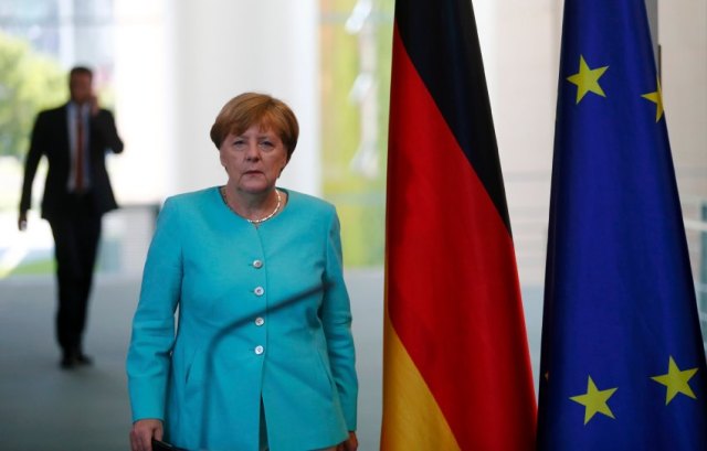 German Chancellor Merkel arrives for a statement in Berlin
